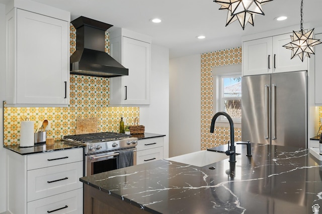 1148 E Kensington Ave, Salt Lake City, UT 84105 - kitchen with wall chimney range hood, backsplash, recessed lighting, and stainless steel appliances