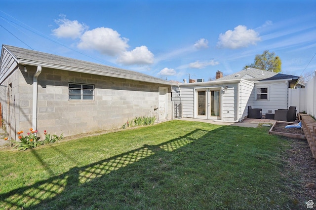 1148 E Kensington Ave, Salt Lake City, UT 84105 - rear view of property with a yard, french doors, a patio, and concrete block siding
