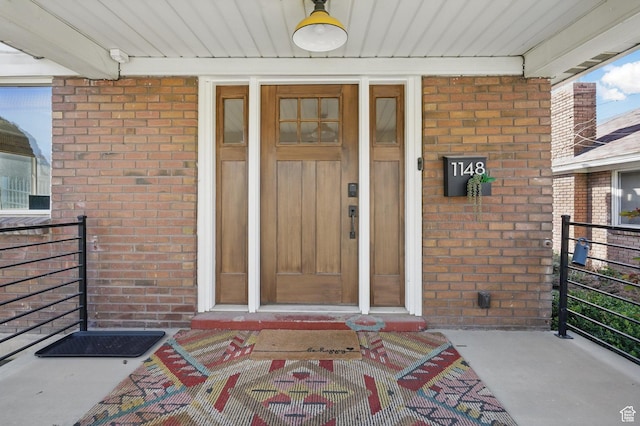1148 E Kensington Ave, Salt Lake City, UT 84105 - doorway to property featuring brick siding and covered porch