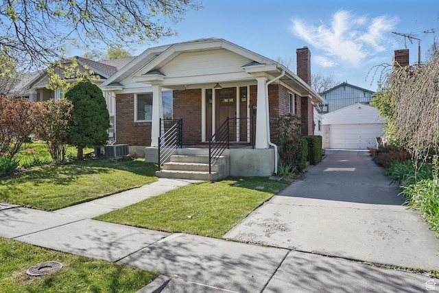 1148 E Kensington Ave, Salt Lake City, UT 84105 - bungalow with a front yard, a garage, a chimney, an outdoor structure, and brick siding