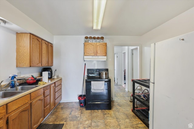 14 E Main St, Goshen, UT 84633 - kitchen with a sink, freestanding refrigerator, black electric range oven, stone finish floor, and under cabinet range hood