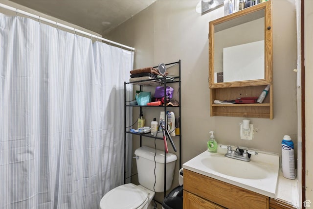 14 E Main St, Goshen, UT 84633 - bathroom with toilet, curtained shower, and vanity
