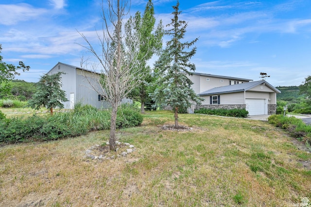 9906 E Lake Pines Dr Unit 1187, Heber City, UT 84032 - view of yard featuring an outdoor structure, a garage, and concrete driveway