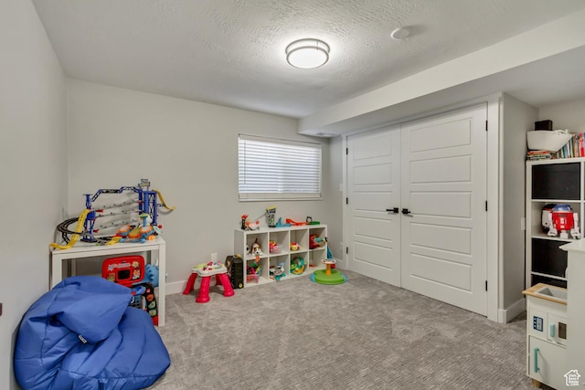 10078 S Shetland Cir S, Jordan, UT 84009 - recreation room featuring carpet floors, baseboards, and a textured ceiling