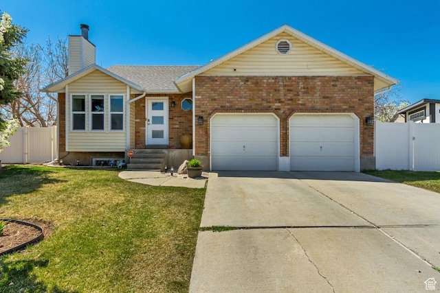 ranch-style house featuring a front lawn, a gate, an attached garage, a chimney, and driveway