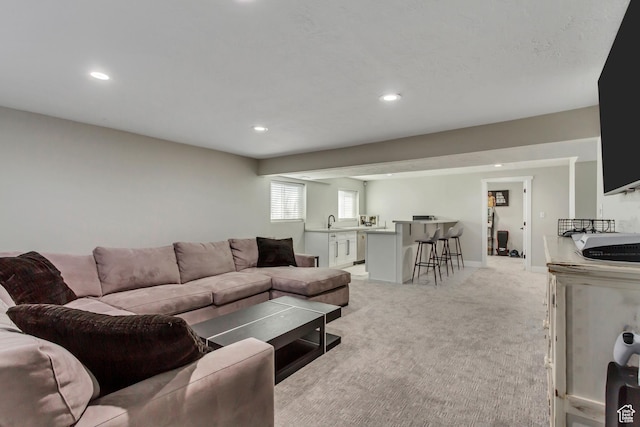 10078 S Shetland Cir S, Jordan, UT 84009 - living area featuring light carpet, baseboards, and recessed lighting