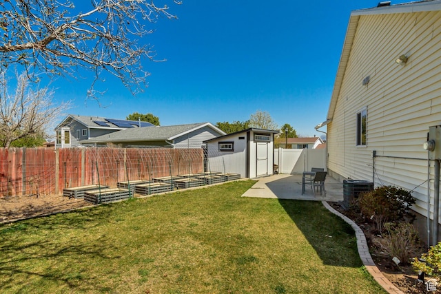 10078 S Shetland Cir S, Jordan, UT 84009 - view of yard featuring an outbuilding, central AC, a fenced backyard, a garden, and a patio