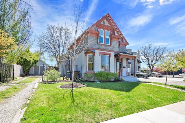 408 E 1700 S, Salt Lake City, UT 84115 - victorian-style house featuring an outbuilding, a front yard, and fence