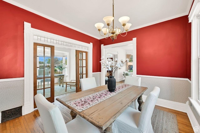 408 E 1700 S, Salt Lake City, UT 84115 - dining space featuring hardwood / wood-style floors, french doors, an inviting chandelier, and ornamental molding