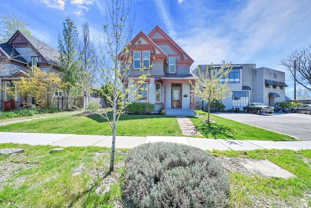 408 E 1700 S, Salt Lake City, UT 84115 - view of front facade featuring a front lawn and fence