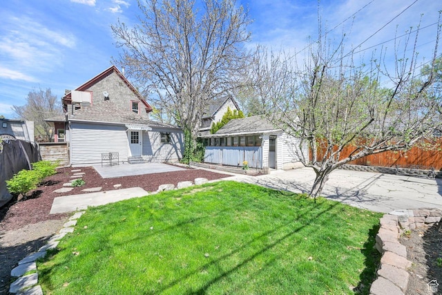 408 E 1700 S, Salt Lake City, UT 84115 - view of yard featuring a patio area, entry steps, and a fenced backyard
