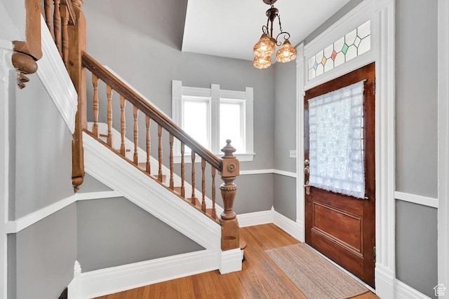 408 E 1700 S, Salt Lake City, UT 84115 - foyer featuring stairs, a notable chandelier, baseboards, and wood finished floors