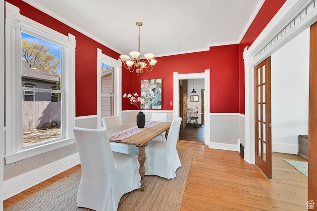 408 E 1700 S, Salt Lake City, UT 84115 - dining room featuring a chandelier, light wood-style flooring, crown molding, and a healthy amount of sunlight