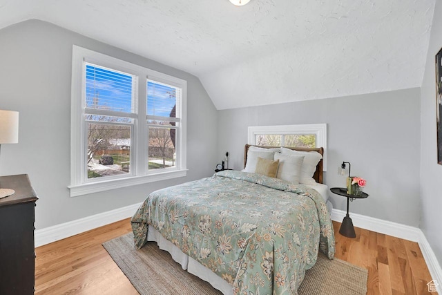 408 E 1700 S, Salt Lake City, UT 84115 - bedroom with baseboards, multiple windows, and vaulted ceiling