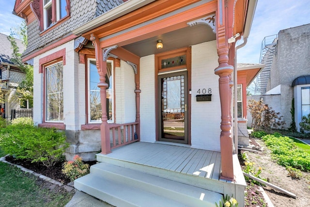 408 E 1700 S, Salt Lake City, UT 84115 - doorway to property featuring covered porch and brick siding