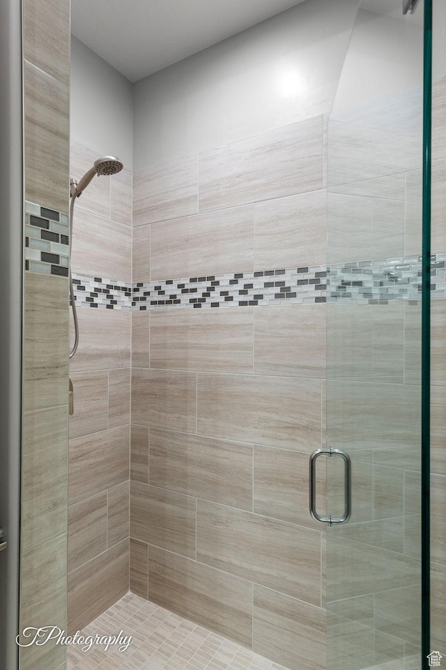 full bath featuring a shower stall