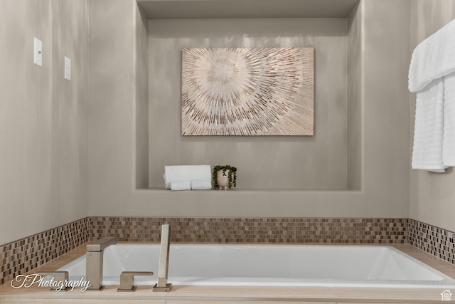 full bathroom featuring a bath