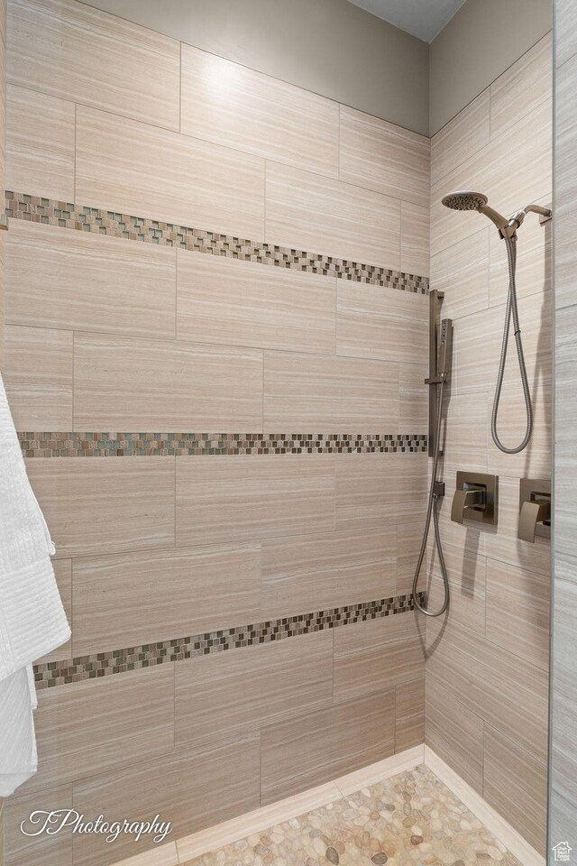 full bathroom with a tile shower