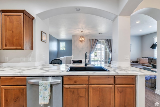1113 W 160 N, Pleasant Grove, UT 84062 - kitchen with dishwasher, brown cabinets, a sink, and a healthy amount of sunlight