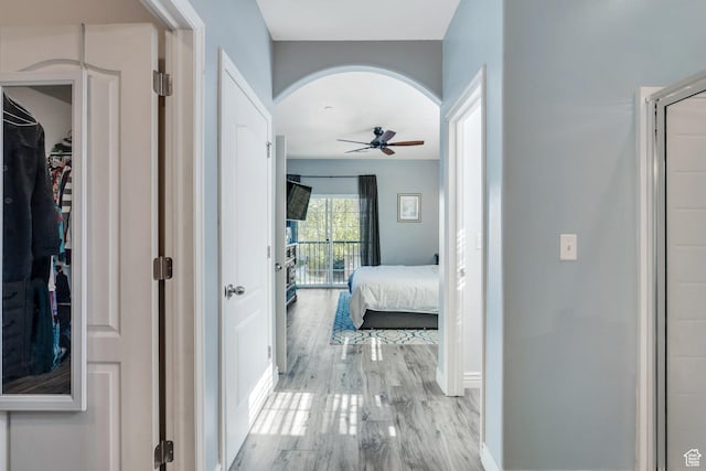 1113 W 160 N, Pleasant Grove, UT 84062 - corridor featuring arched walkways, baseboards, and wood finished floors