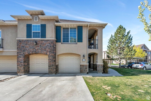 view of front facade with stone siding, a garage, stucco siding, a front lawn, and driveway