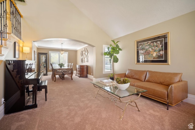 1778 E Indian Wells Ln, Draper, UT 84020 - living room featuring arched walkways, high vaulted ceiling, baseboards, and carpet