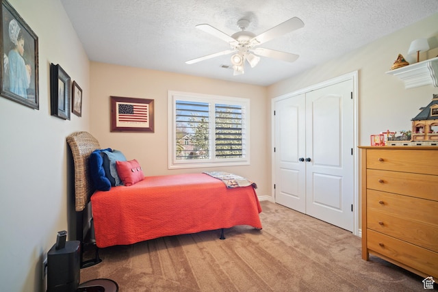 1778 E Indian Wells Ln, Draper, UT 84020 - bedroom featuring a closet, visible vents, ceiling fan, a textured ceiling, and light colored carpet
