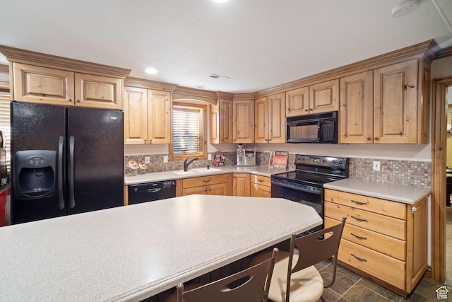 1778 E Indian Wells Ln, Draper, UT 84020 - kitchen with visible vents, a sink, light countertops, black appliances, and decorative backsplash