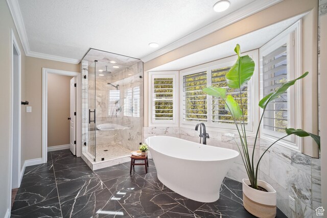 1778 E Indian Wells Ln, Draper, UT 84020 - bathroom featuring crown molding, a soaking tub, a shower stall, marble finish floor, and baseboards
