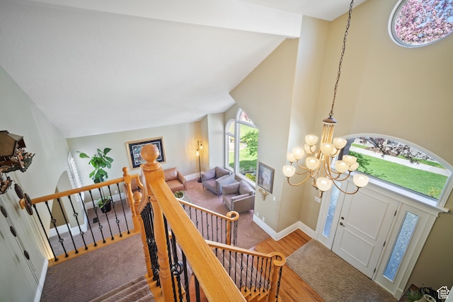 1778 E Indian Wells Ln, Draper, UT 84020 - foyer with baseboards, high vaulted ceiling, a notable chandelier, and wood finished floors