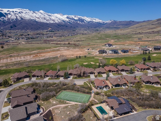 aerial view featuring a mountain view and a residential view