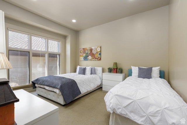 carpeted bedroom with recessed lighting