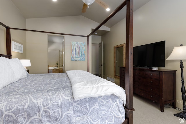 bedroom featuring baseboards, ceiling fan, ensuite bath, light colored carpet, and lofted ceiling