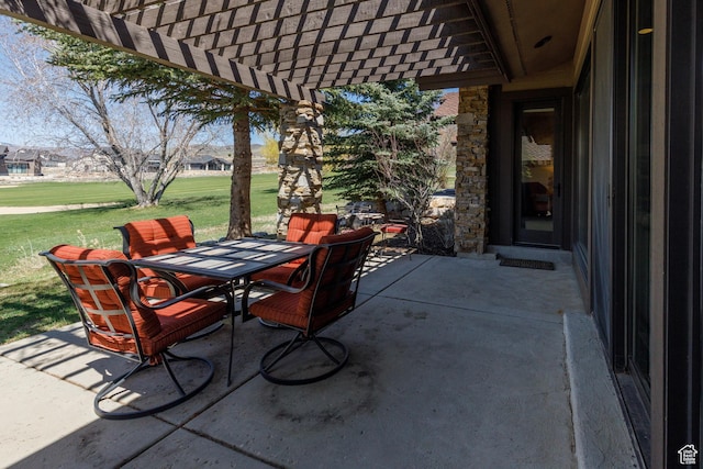 view of patio featuring a pergola and outdoor dining area