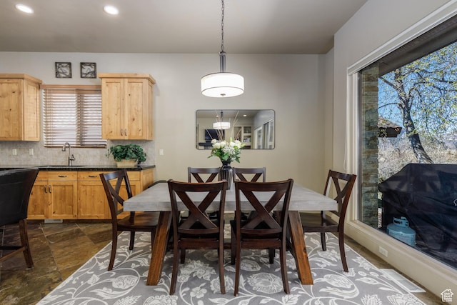 dining room featuring recessed lighting and stone finish flooring