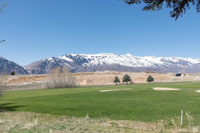 property view of mountains featuring view of golf course