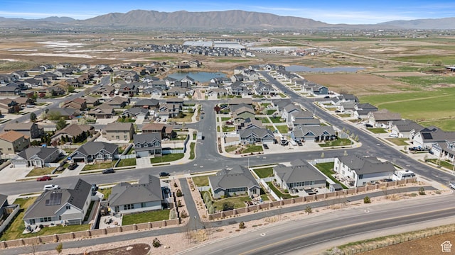 bird's eye view with a residential view and a water and mountain view