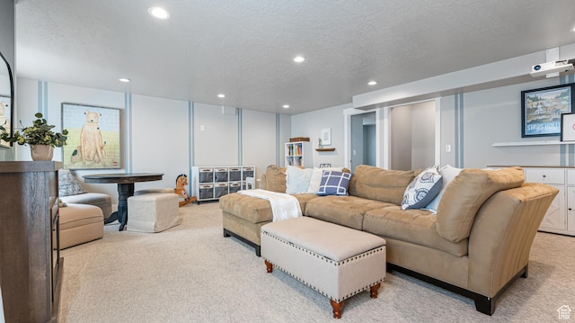 living room featuring recessed lighting, light colored carpet, and a textured ceiling