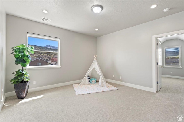 game room featuring baseboards, carpet, visible vents, and plenty of natural light