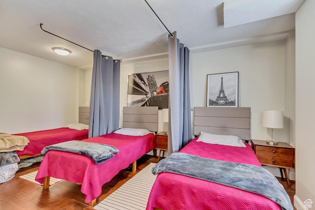 bedroom featuring wood finished floors