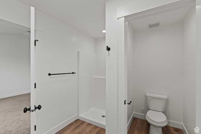 232 N 300 W, Preston, ID 83263 - bathroom featuring a shower stall, toilet, wood finished floors, and baseboards