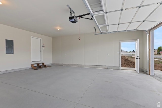 232 N 300 W, Preston, ID 83263 - garage featuring electric panel, a garage door opener, and baseboards