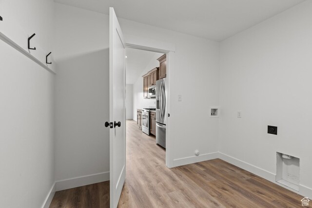 232 N 300 W, Preston, ID 83263 - clothes washing area with hookup for an electric dryer, washer hookup, light wood-type flooring, and baseboards