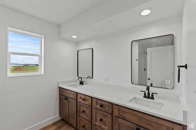 232 N 300 W, Preston, ID 83263 - full bathroom featuring double vanity, baseboards, wood finished floors, and recessed lighting