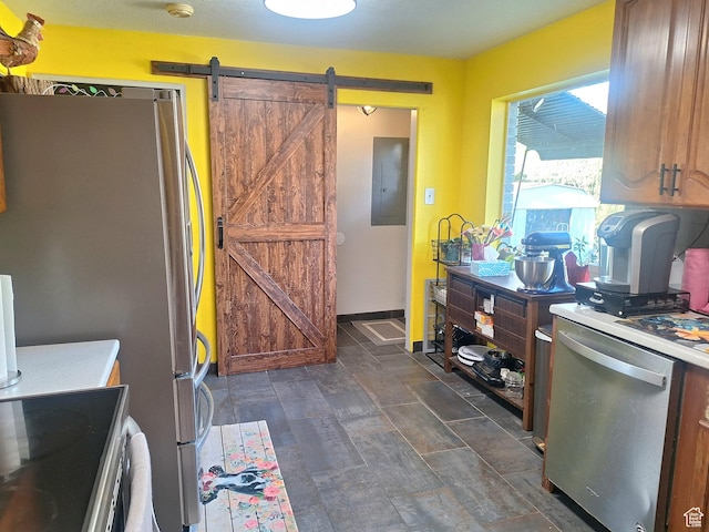 3150 N Iowa Ave W, Ogden, UT 84403 - kitchen featuring electric panel, light countertops, freestanding refrigerator, a barn door, and fridge