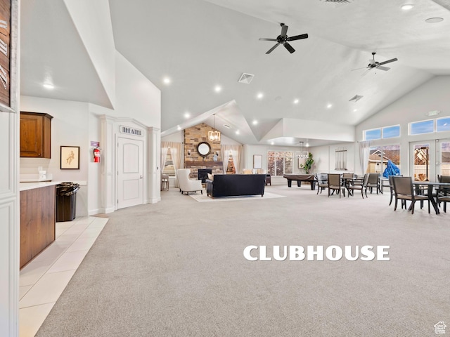 1262 S 50 E Unit 3, Lehi, UT 84043 - living area with a stone fireplace, light carpet, recessed lighting, visible vents, and high vaulted ceiling