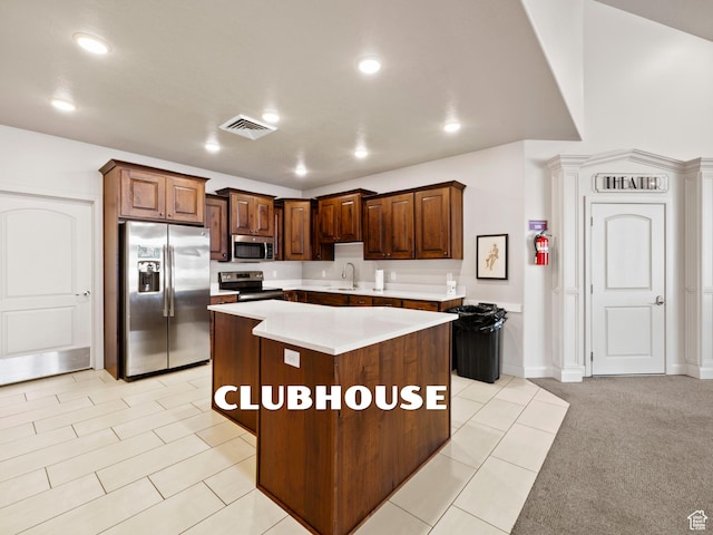 1262 S 50 E Unit 3, Lehi, UT 84043 - kitchen featuring light countertops, a center island, visible vents, stainless steel appliances, and a sink