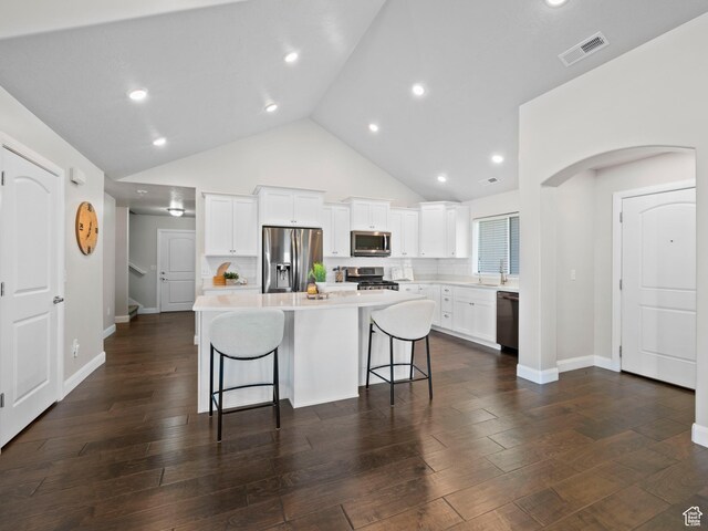 1262 S 50 E Unit 3, Lehi, UT 84043 - kitchen with a kitchen breakfast bar, visible vents, a kitchen island, appliances with stainless steel finishes, and light countertops