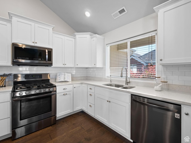 1262 S 50 E Unit 3, Lehi, UT 84043 - kitchen with dark wood-type flooring, visible vents, appliances with stainless steel finishes, a sink, and lofted ceiling
