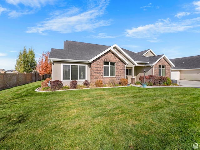 1262 S 50 E Unit 3, Lehi, UT 84043 - craftsman house featuring roof with shingles, a front yard, brick siding, and fence